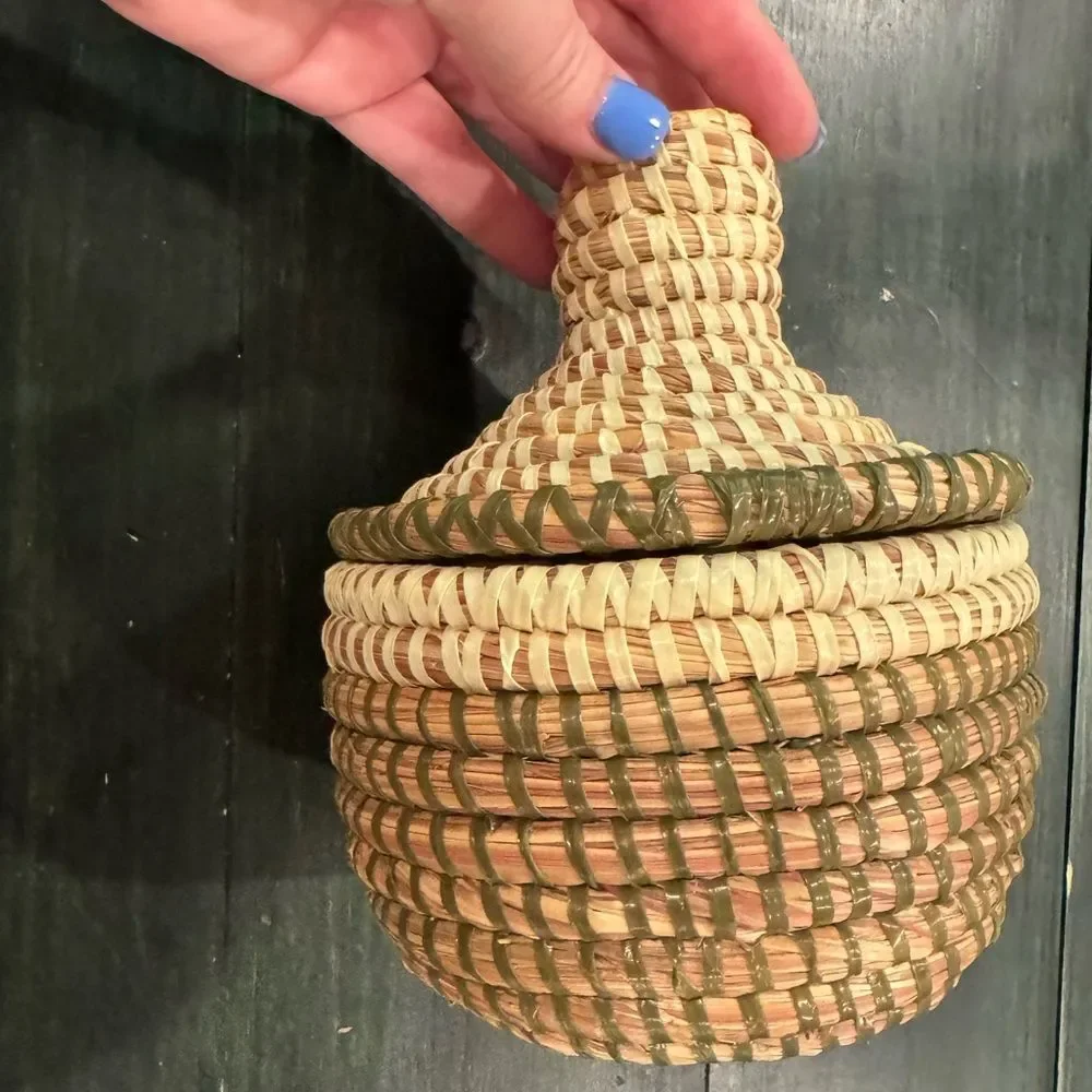 Handwoven sweetgrass coiled basket with a fitted lid